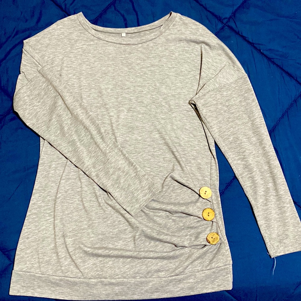 Heather grey long sleeve shirt with button detail.